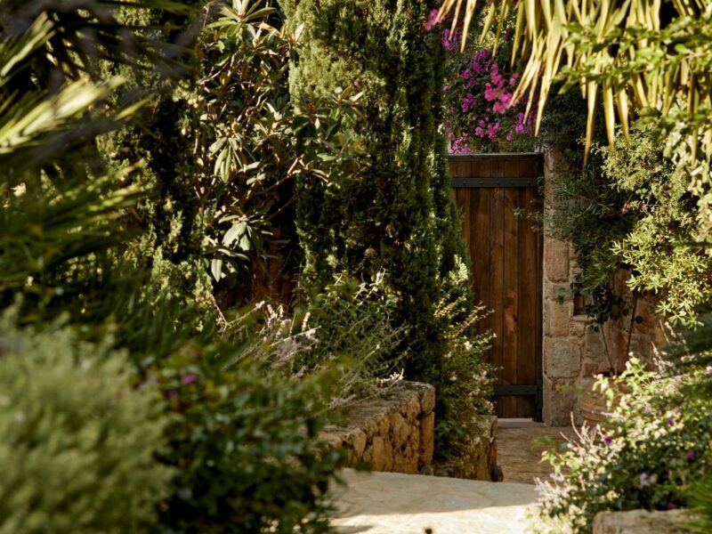 wooden yard door of a welless retreat in Greece