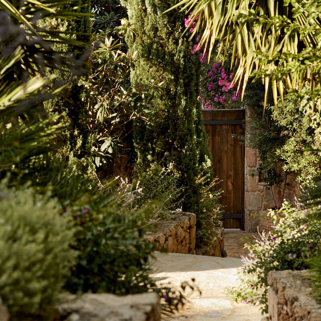 wooden yard door of a welless retreat in Greece