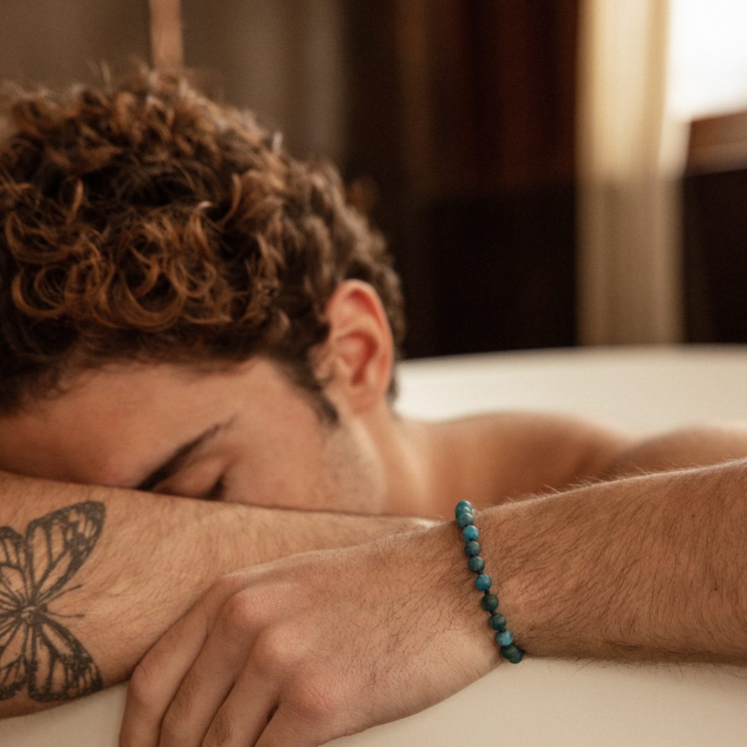 a man wearing a greek handmade bracelet