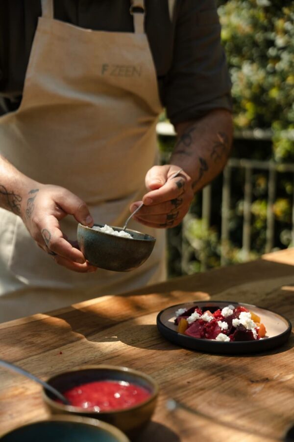 chef serving food on an authentic greek restaurant