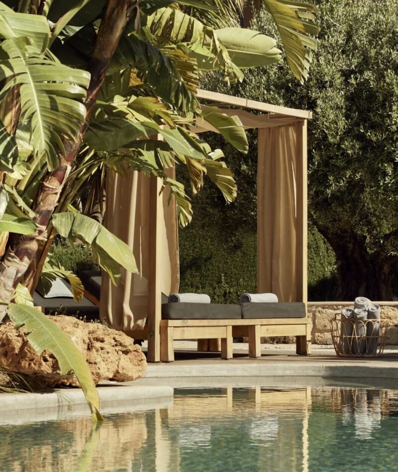 two sunbeds beside a pool on Fzeen Suite