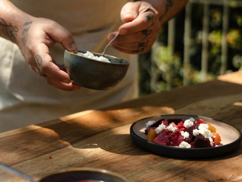 chef serving food on an authentic greek restaurant