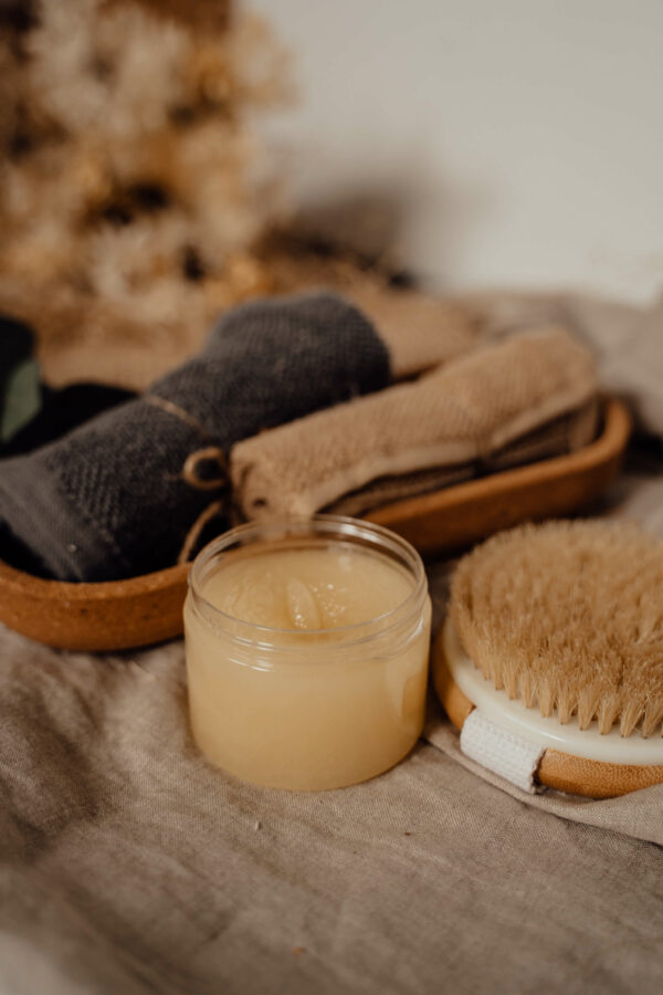 candle towels and brush of a wellness spa hotel in Greece