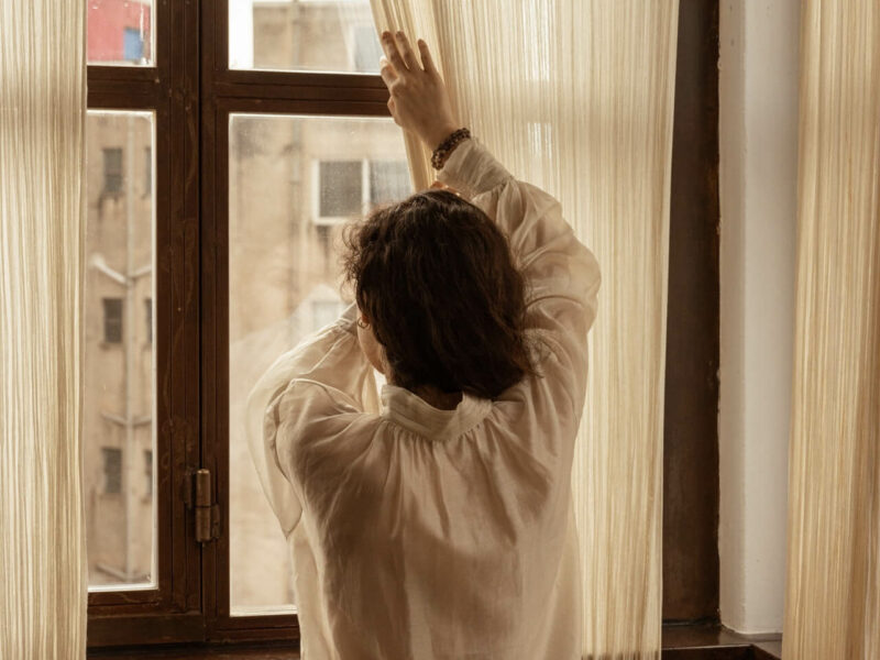 window view of a kid wearing greek handmade products