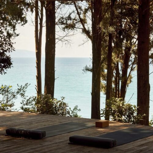 yoga mattresses on a wooden patio