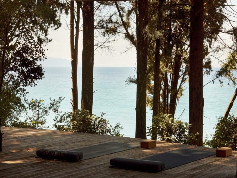 yoga mattresses on a wooden patio