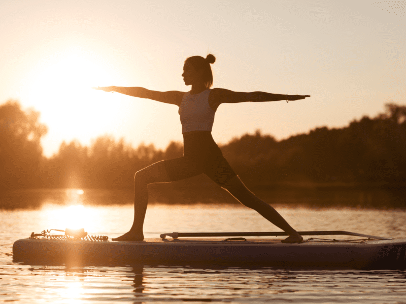 Woman doing yoga on a sup