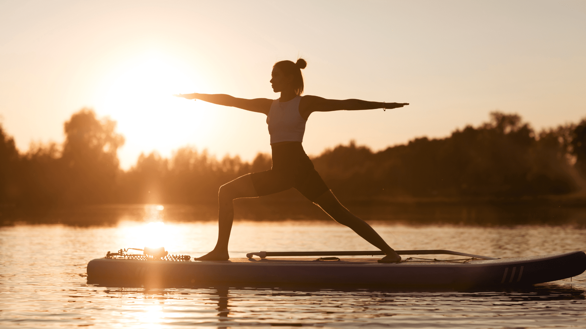 Woman doing yoga on a sup